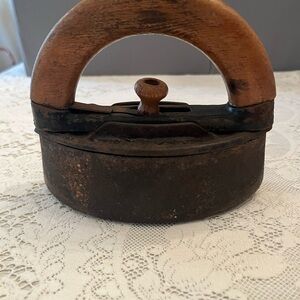 Antique Sad Iron with Wooden Handle. Makes a great doorstop.